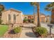 Single-story house with a landscaped yard, driveway, and a two-car garage at 2824 Evening Rock St, Las Vegas, NV 89135