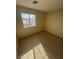 Spacious bedroom with large window and carpeted floors at 3023 Sunset Harbor Ct, North Las Vegas, NV 89031