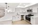 Bright, modern kitchen featuring white shaker cabinets, stainless steel appliances, and quartz countertops at 3768 Territory St, Las Vegas, NV 89121