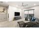 Bright bonus room with a white brick accent wall and home gym at 4024 Desert Trace Ct, Las Vegas, NV 89129