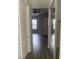 Hallway with wood-look flooring and access to bedrooms at 50 E Serene Ave # 207, Las Vegas, NV 89123