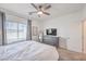 Bright bedroom with a dresser, TV, and ceiling fan at 600 N Carriage Hill Dr # 1187, Las Vegas, NV 89138