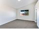 Well-lit bedroom featuring neutral wall paint and carpet flooring at 601 Harvest Run Dr # 201, Las Vegas, NV 89145