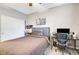 Spacious bedroom with double doors and a built-in workspace at 625 Doubleshot Ln, Henderson, NV 89052