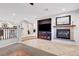 Living area with a fireplace and built-in entertainment center at 625 Doubleshot Ln, Henderson, NV 89052