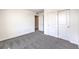 Spacious bedroom with a double door closet and grey carpet at 7533 Cooper Cove Dr # Lot 13, North Las Vegas, NV 89084