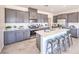 Spacious kitchen with island and stainless steel appliances at 7533 Cooper Cove Dr # Lot 13, North Las Vegas, NV 89084