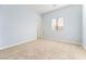 Simple bedroom with neutral walls and carpet at 7641 Riva Ridge St, Las Vegas, NV 89149