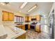 Open kitchen with island and stainless steel appliances at 7900 Mt Shasta Cir, Las Vegas, NV 89145