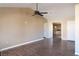 Bright living room with hardwood floors and ceiling fan at 8560 Desert Holly Dr, Las Vegas, NV 89134