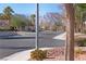 Residential street view, showcasing homes and mountain backdrop at 8560 Desert Holly Dr, Las Vegas, NV 89134