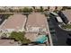 Aerial view of building, pool, parking and surrounding homes at 9330 W Maule Ave # 208, Las Vegas, NV 89148