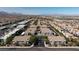 Aerial view of community showing building, pool, and parking at 9330 W Maule Ave # 208, Las Vegas, NV 89148