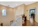 Upstairs hallway with hardwood floors and access to bedrooms at 9715 Aleutian St, Las Vegas, NV 89178