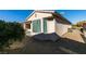 Backyard view of home with gravel and shrubs at 10389 Felice Ave, Las Vegas, NV 89135