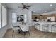 Modern kitchen with white and wood cabinets, large island, and stainless steel appliances at 10389 Felice Ave, Las Vegas, NV 89135