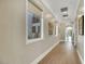 Light-filled hallway with hardwood floors and elegant wall art at 1529 Villa Rica Dr, Henderson, NV 89052