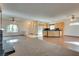 Open plan living room, kitchen, and dining area with wood floors at 2129 Colvin Run Dr, Henderson, NV 89052