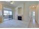 Bright living room with fireplace, sliding door to balcony at 2305 W Horizon Ridge Pkwy # 2024, Henderson, NV 89052