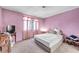 Pink bedroom with bed, dresser, and window with pink curtains at 2504 Paradise Village Way, Las Vegas, NV 89120