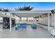 Outdoor lounge area with blue seating, fireplace, and pergola at 2700 Las Vegas Blvd # 2004, Las Vegas, NV 89109