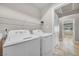 Convenient laundry room with full-size washer and dryer at 309 Wild Plum Ln, Las Vegas, NV 89107