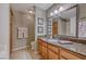 Bathroom boasts granite vanity and a large mirror at 3145 E Flamingo Rd # 1045, Las Vegas, NV 89121