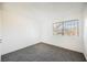 Bright bedroom with grey carpet, large window, and ample wall space at 3366 Loma Linda Ln, Las Vegas, NV 89121