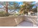 Private balcony overlooking lush trees and landscaping at 3425 E Russell Rd # 240, Las Vegas, NV 89120