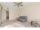 Bright bedroom with a comfy sofa and glass-top coffee table at 3425 E Russell Rd # 240, Las Vegas, NV 89120