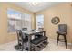 Dining area with table, bench seating and wall art at 3425 E Russell Rd # 240, Las Vegas, NV 89120