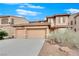 Two-story house with three-car garage and desert landscaping at 4028 Kristina Lynn Ave, North Las Vegas, NV 89081