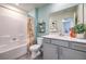 Clean bathroom with gray vanity and a shower/tub combo at 5655 Scarlet Rock St # Lot 93, North Las Vegas, NV 89081