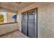 Private balcony with sliding glass doors and screened enclosure at 6117 W Oakey Blvd # A, Las Vegas, NV 89146