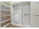 Spacious walk-in closet with shelving and rods at 9936 Coyote Echo Ct, Las Vegas, NV 89166