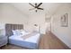 Spacious bedroom with plush bed, hardwood floors, and access to hallway at 10624 Mission Lakes Ave, Las Vegas, NV 89134