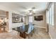 Elegant dining room with a large dark wood table and light blue chairs at 1138 Grove Park St, Henderson, NV 89002