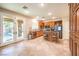 Modern kitchen with wood cabinets, stainless steel appliances, and an island at 1138 Grove Park St, Henderson, NV 89002