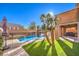 Inviting backyard pool and spa with artificial turf and a fence at 1138 Grove Park St, Henderson, NV 89002