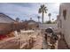 Outdoor patio with seating, grill, and a propane tank at 2708 Cheshire Ct, Las Vegas, NV 89108