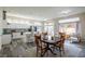 Kitchen and dining area with wood table and chairs, open to the living room at 2709 Orchid Valley Dr, Las Vegas, NV 89134