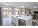 Kitchen island with white cabinets and stainless steel appliances at 2709 Orchid Valley Dr, Las Vegas, NV 89134