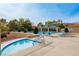 Community pool and spa with ample lounge chairs and covered seating areas at 2709 Orchid Valley Dr, Las Vegas, NV 89134