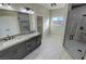 Elegant bathroom with double vanity, granite countertops, and a large shower at 2800 Wisteria Way, Pahrump, NV 89048