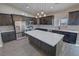 Modern kitchen with stainless steel appliances and an island at 2800 Wisteria Way, Pahrump, NV 89048