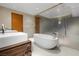 Luxurious bathroom with soaking tub, double vanity, and glass shower at 3750 Las Vegas Blvd # 2608, Las Vegas, NV 89158