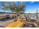 Community patio with picnic tables and a grill at 3930 University Center Dr # 208, Las Vegas, NV 89119