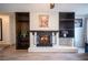 Brick fireplace with a wood mantel and hearth at 4250 Carolyn Dr, Las Vegas, NV 89103