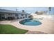 Kidney shaped pool with surrounding patio and grassy area at 4250 Carolyn Dr, Las Vegas, NV 89103