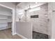 Walk-in shower with marble tile and a modern design at 4591 Stonebridge, Las Vegas, NV 89061